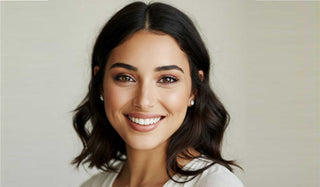 Woman with dark hair and a light background